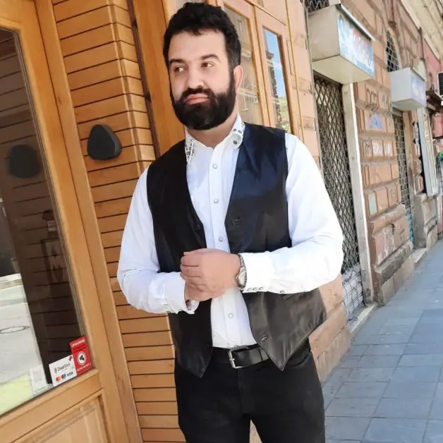 Leon Papo wearing a leather vest